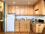 Kitchen with apartment sized fridge